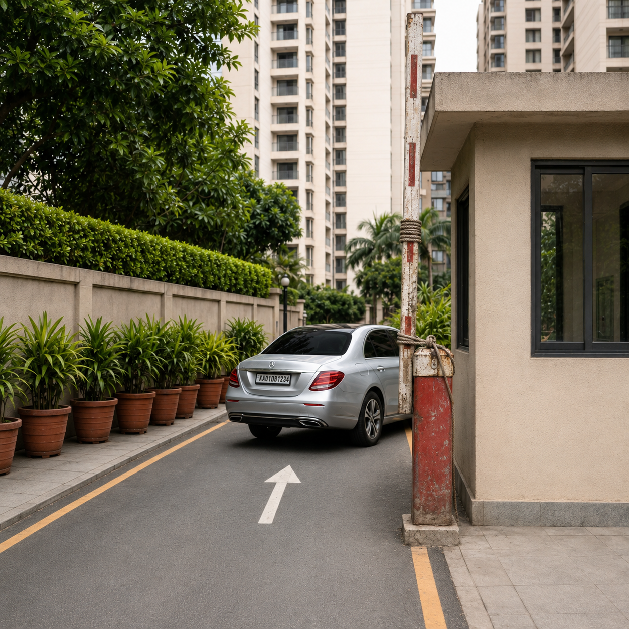 Boom barrier at a society gate with a car waiting to enter